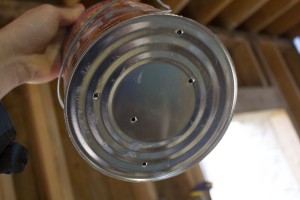 paint can with holes in it