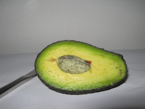 Avocado cut in half with seed visible